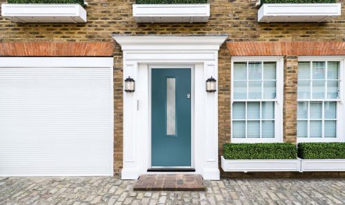 custom composite door in blue with white door frame and glazing